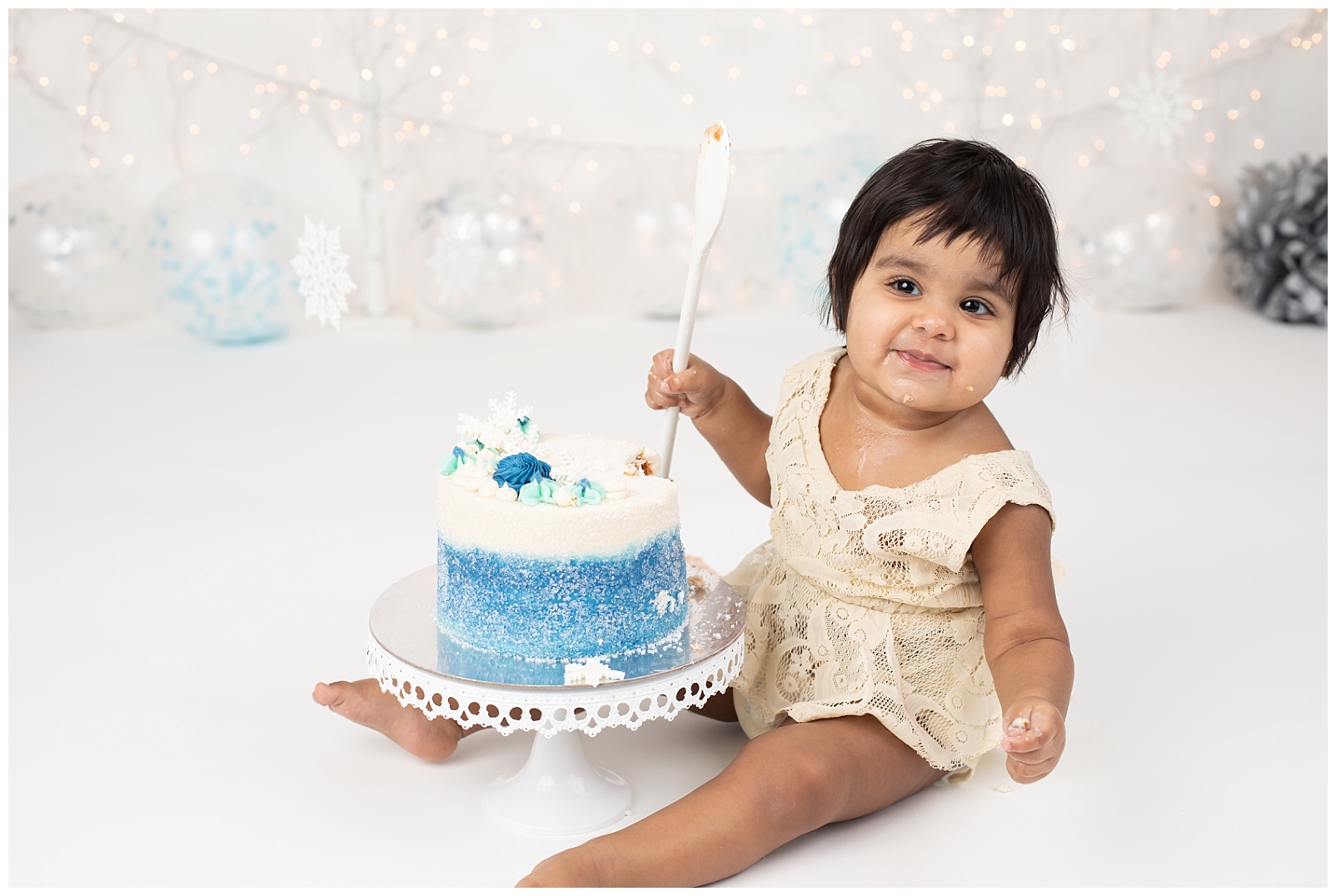 Baby smiling during cake smash