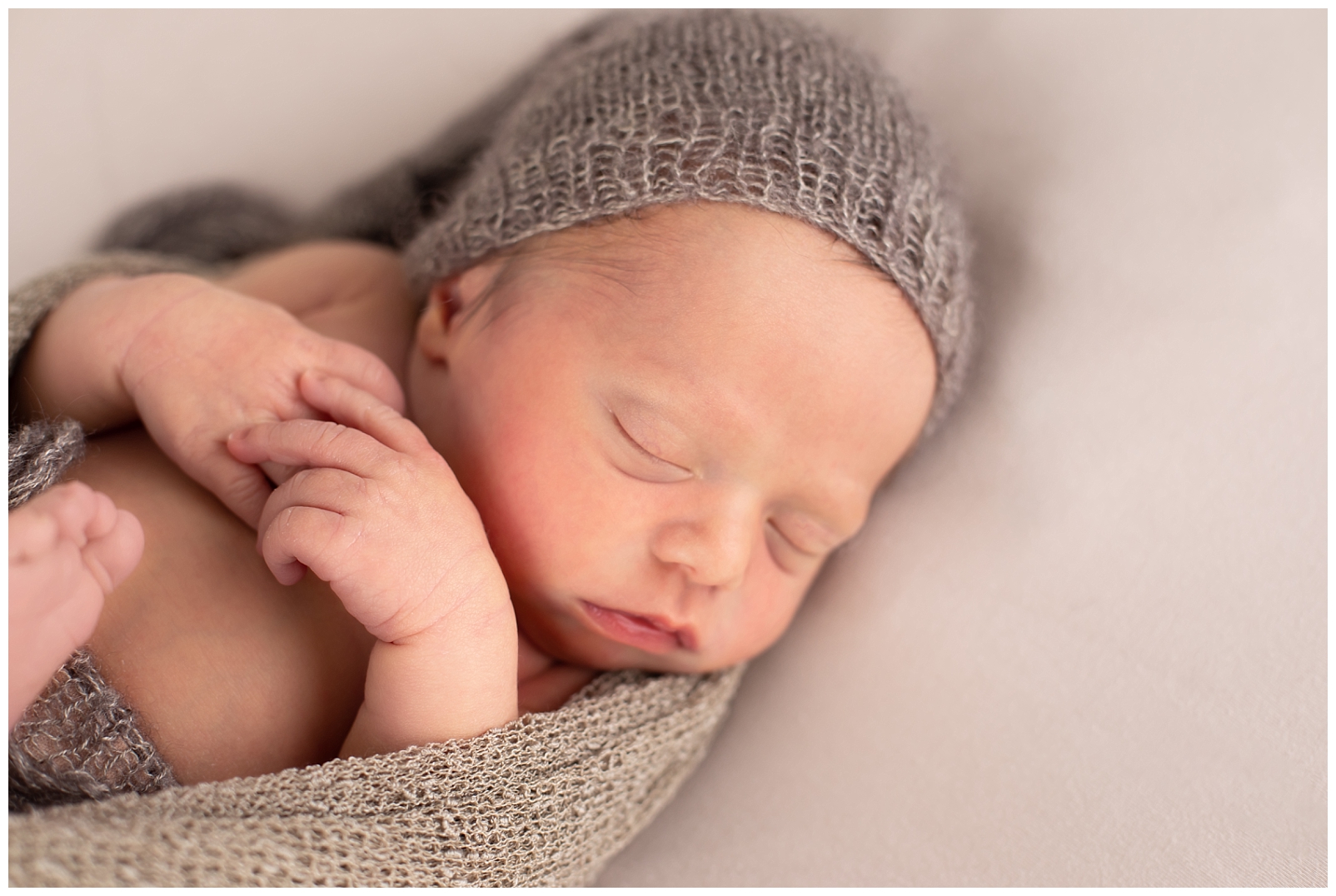 newborn sleeping with hat