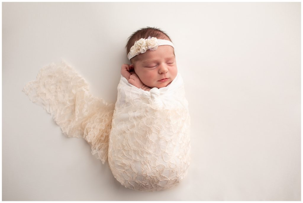 newborn in lace wrap