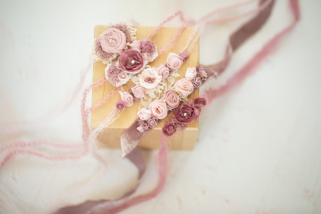 The Sweet Rose Collection displayed on a wooden block
