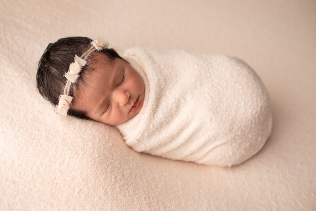 Felicity Headband on a wrapped newborn