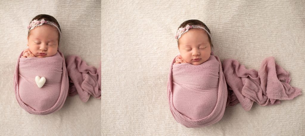 Newborn wrapped with mauve color wrap and a white felted heart