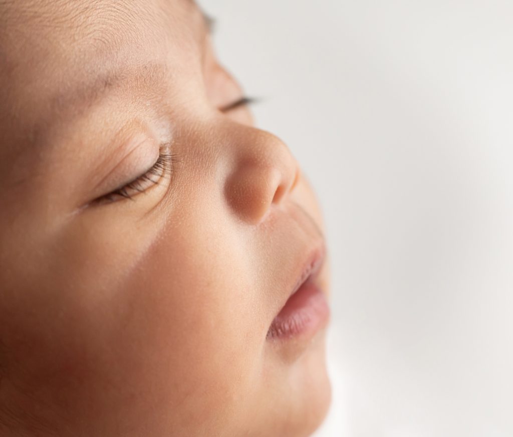 macro photo of newborn cheek and facial features