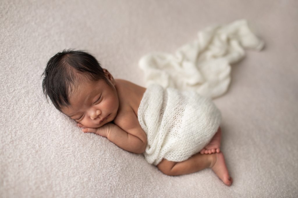 newborn on tummy lying pose