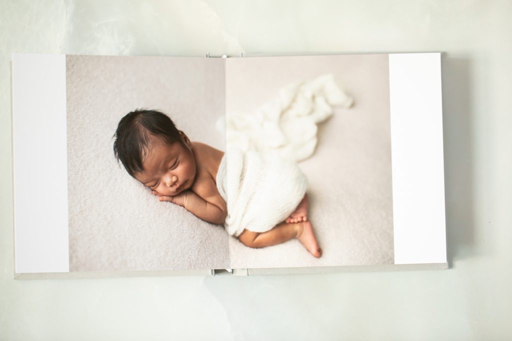 newborn portrait in a album
