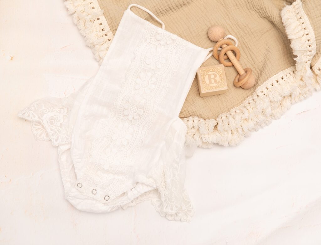 baby girls white lace romper with wooden rattle and block - Howard County Baby photographer