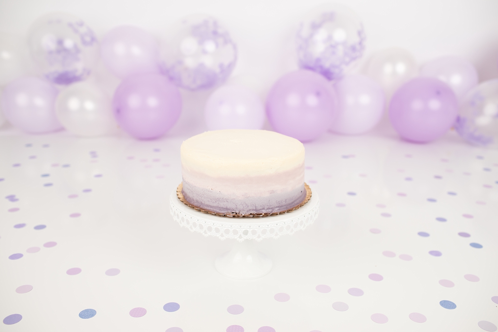 Ombre cake with lavender and polka dots and polka dot balloons | How to Choose a Smash Cake