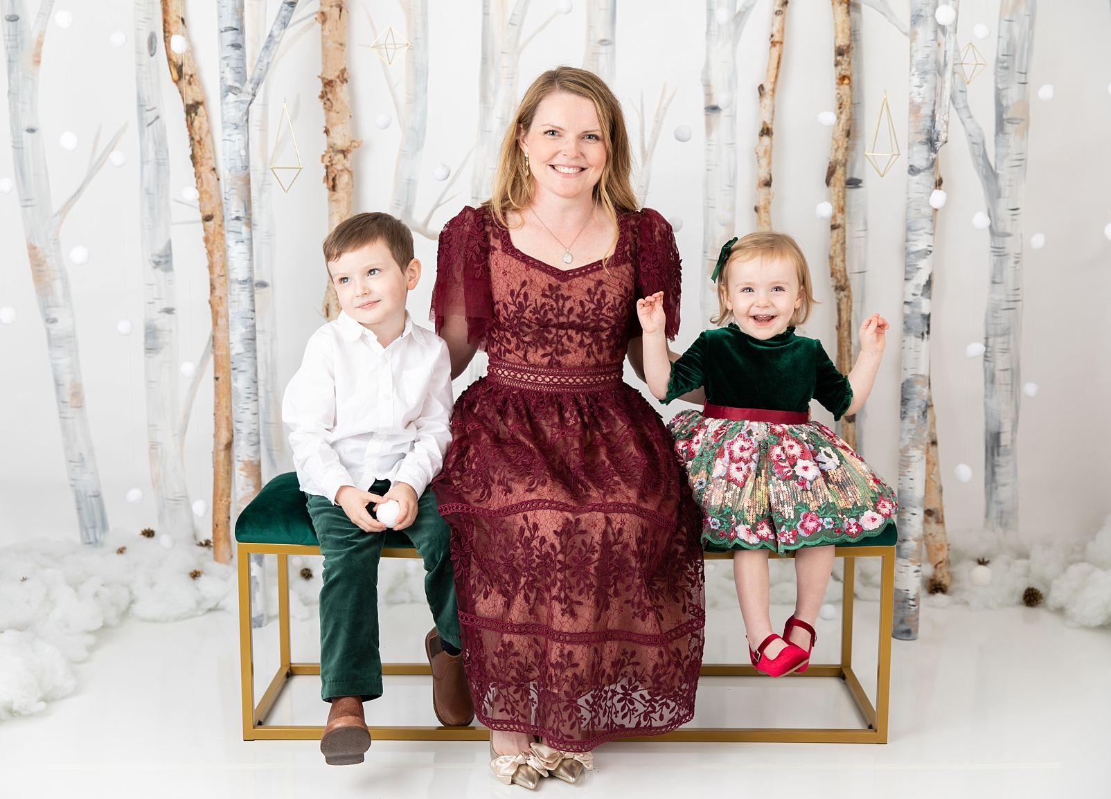 mom and children in front of birch trees and snowballs for Christmas Studio Minis Maryland
