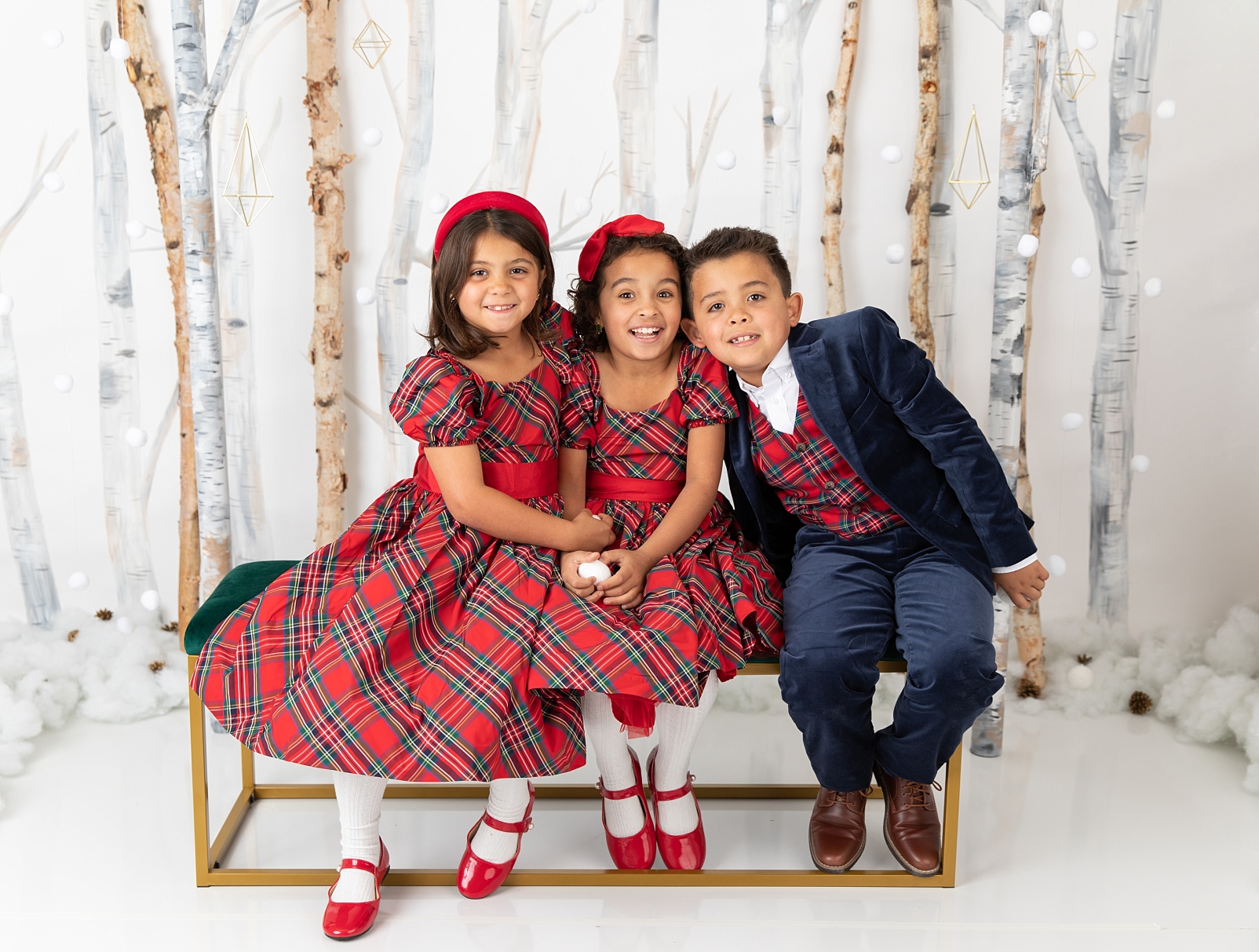 triplets sitting in front of birch trees and snowballs for Christmas Studio Minis Maryland