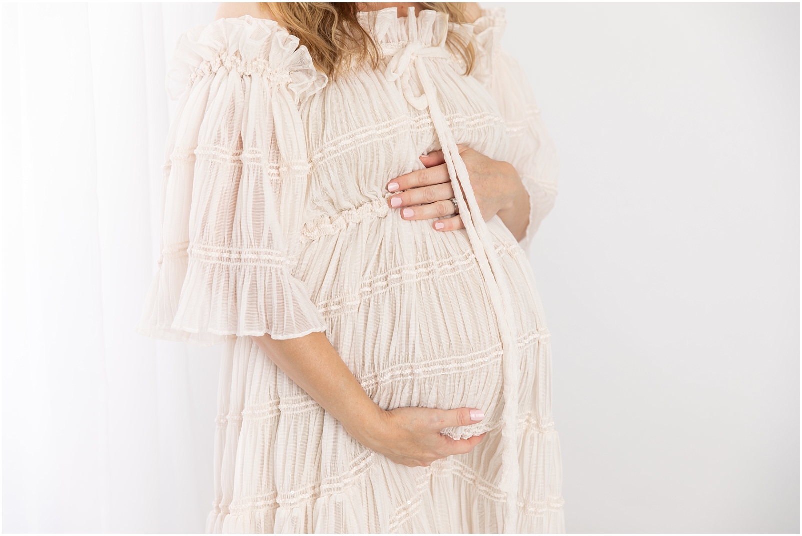 Mom wearing a textured flowy maternity gown- Rebecca Leigh Photography