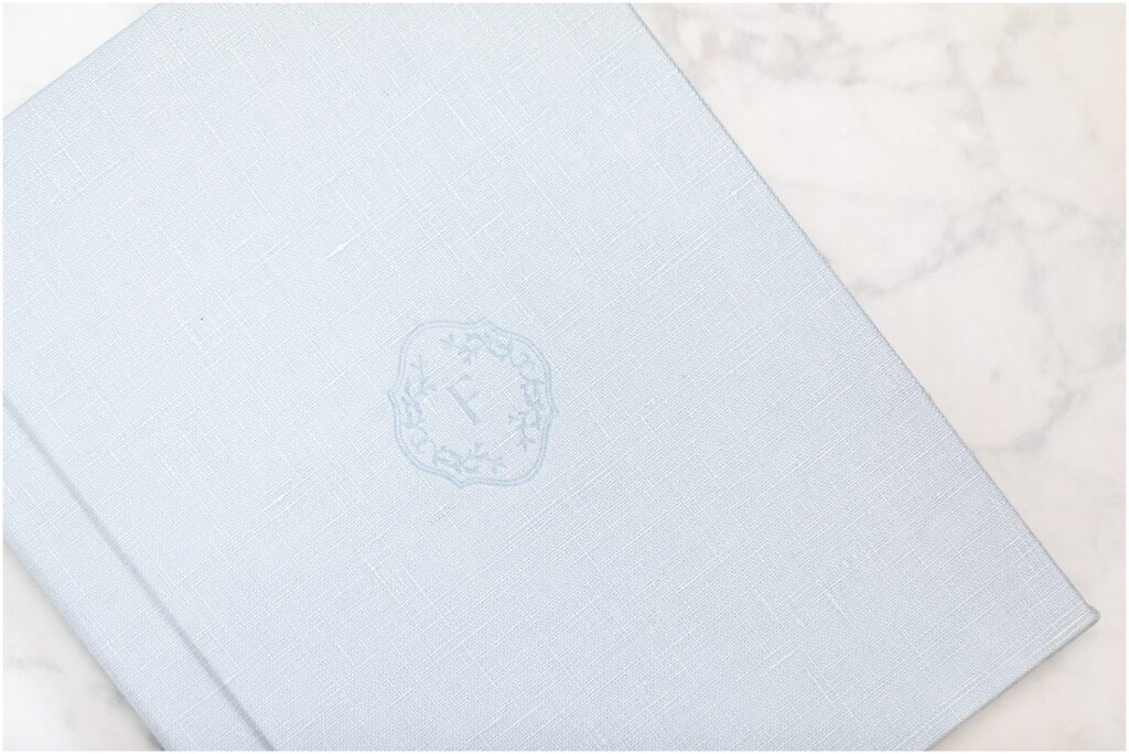 Light blue linen heirloom album with blind embossing cover design | Rebecca Leigh Photography