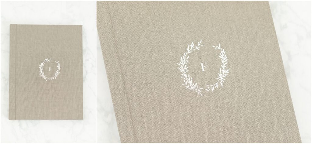 Silver embossing with a wreath and letter on a gray linen album